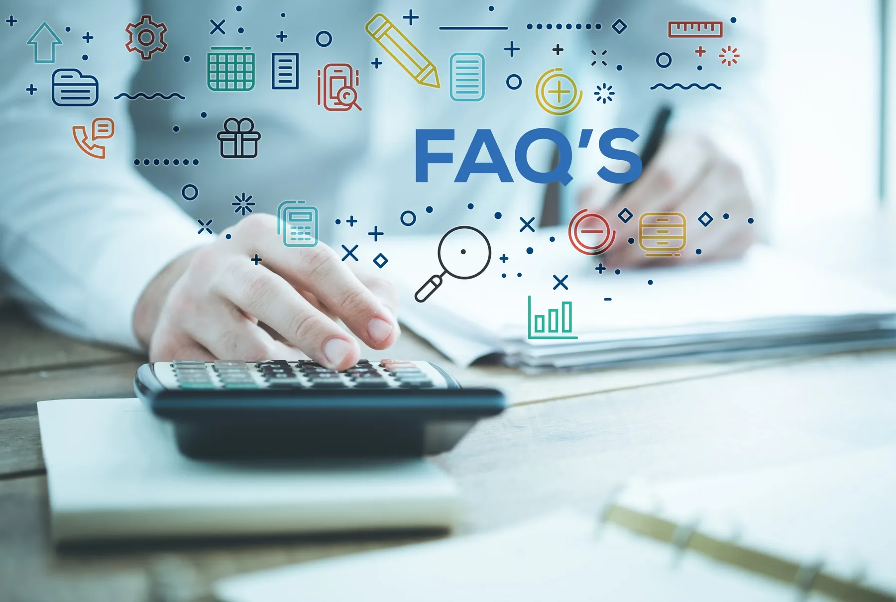 A desk scene with a hand using a calculator and illustrated icons and the letters FAQ floating above.